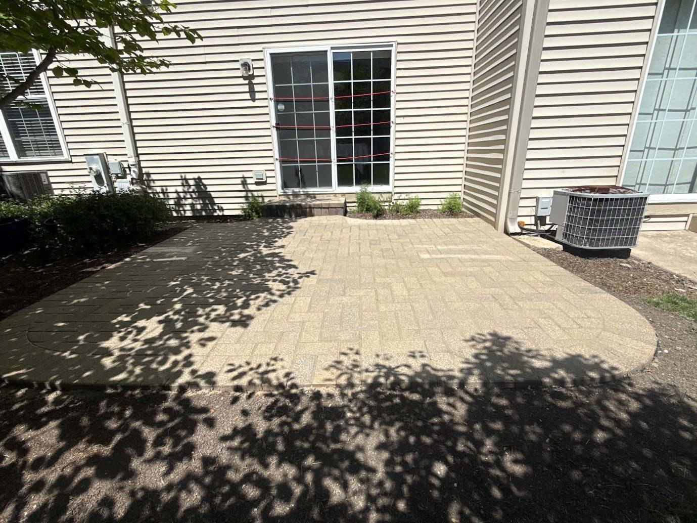 Newly sealed patio drying with a slight shine from G&D Construction