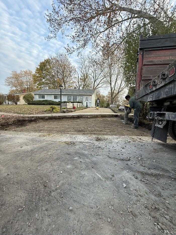 Excavation and base preparation for a brick paver driveway in Lake County
